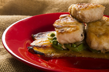 Tucunare fish in butter with green peppers and banana - Traditional Amazonian dish