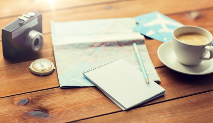 close up of notepad with map and travel tickets