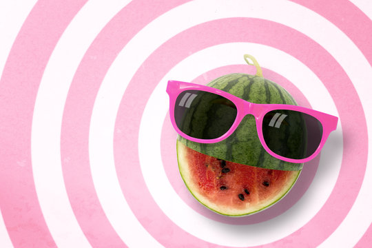 Watermelon wearing sunglasses on circle pattern pink and white background with copy space.,Pastel tone.