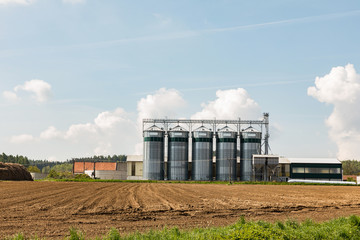 Fototapeta na wymiar Elevator to store grain in a field on farmland