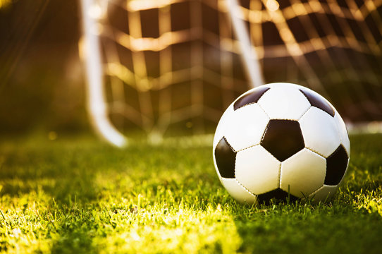 Closeup soccer ball on green grass