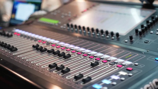 audio mixer in a studio, the automatic knobs moving. Everything is ready for the recording. Soundboard knobs. Digital Sound Mixer In The Disco. Professional audio mixer. audio console in work