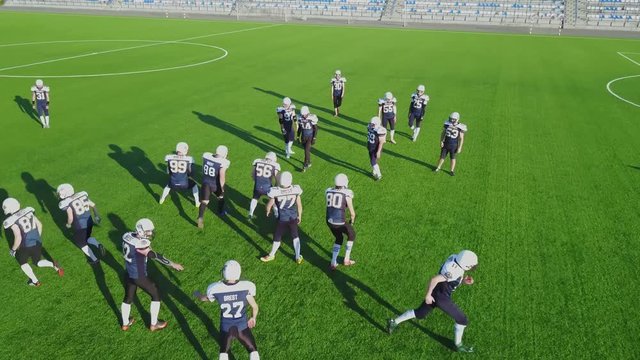 Aerial shooting with a drone as players play football on the field