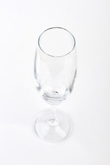 Empty clear champagne glass isolated. Wine glass on white background.