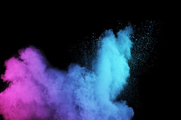 Naklejka na ściany i meble abstract color powder splatted on black background,Freeze motion of color powder exploding