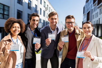 business team with conference badges in city