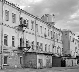 The courtyard of the old industrial building is black and white