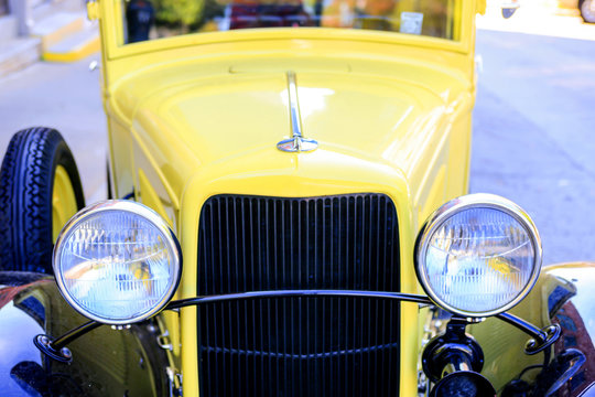 A 1930s yellow pickup truck outside Pack's Tavern on Spruce Street in downtown Asheville NC