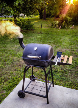 Garden smoker BBQ puffing out smoke