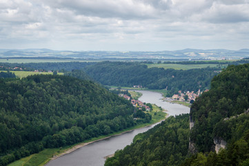 Panorama view from rocks Bastei to river Elbe and Rathen, Saxon Switzerland, Germany