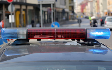flashing sirens of the police car at the checkpoint on the road
