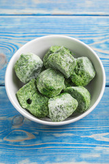 Frozen spinach blocks.
