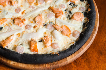 Delicious pizza with meat, cheese and mushrooms