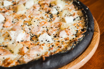 Delicious pizza with meat, cheese and mushrooms