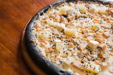 Delicious pizza with meat, cheese and mushrooms