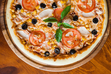 Delicious pizza with meat, cheese and mushrooms