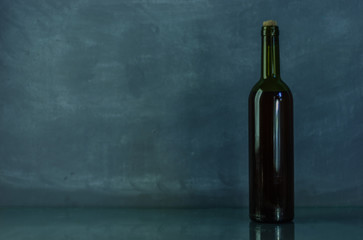 Fototapeta na wymiar Bottle with red wine on a beautiful background