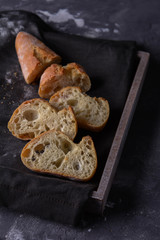 Slashed baguette. White bread.