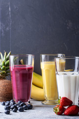 Fototapeta na wymiar Berry, multifruit and banana milkshakes