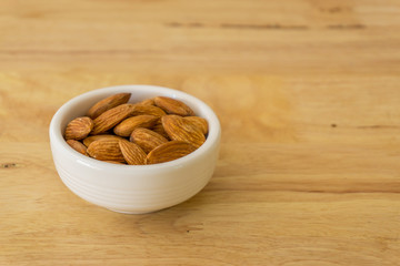 almond nuts in wooden background