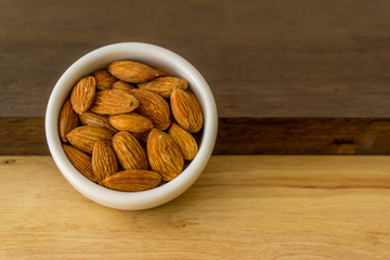 almond nuts in wooden background