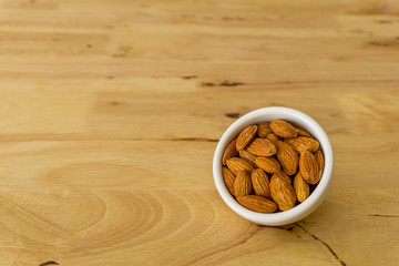 almond nuts in wooden background