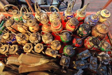 Fototapeta premium Enamel old teapots for sale-stall on Sakkaline road-Luang Prabang-Laos. 4514
