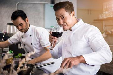 Chef preparing food in the kitchen of a restaurant  