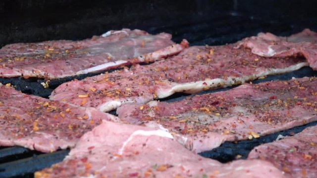 Meat cooking on grill