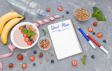 Fototapeta na wymiar Diet Plan concept flat lay porridge, nuts, bananas, fresh berries and bottle of water. Top view. Copy space