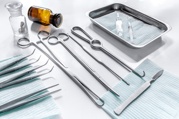 Rejuvenation by plastic surgery: medical instruments on white table backgrond