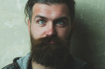 man squinting eyes on silly face