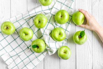 Fototapeta na wymiar summer food with green apples on white background top view
