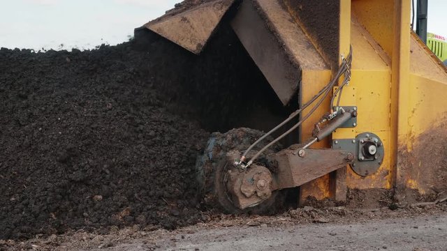 The tractor produces aeration of the compost. Mixes humus and manure
