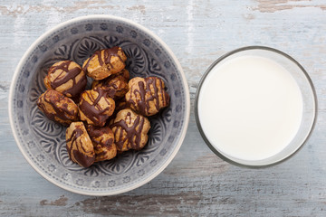 Glass of milk with chocolate biscuits