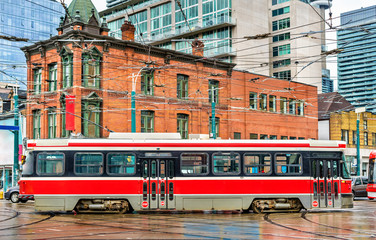Fototapeta na wymiar City tram in Toronto, Queen St West - Spadina Ave