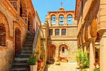 Fototapeta na wymiar The courtyard area of Moni Agiou Ioanni Monastery Theotokou Ipsilou on the Greek island of Lesbos in the Aegean Sea.