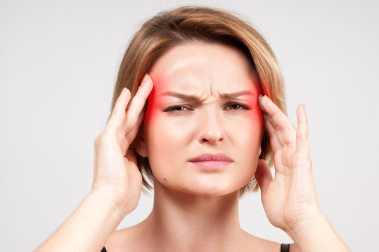 Woman having headache migraine