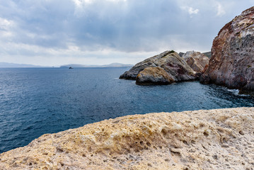 Rocks in Firopotamos Beach in cloudy day, Milos, Cyclades Islands, Greece.