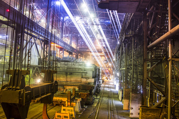 Iron and steel works factory with sun beam