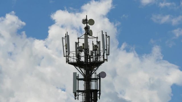 telecommunication cellular tower against blue sky