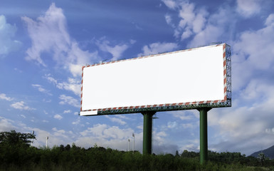 Blank bill board with field and blue sky background