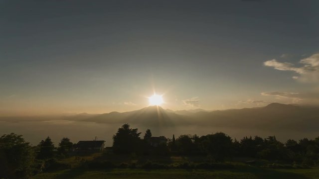 Lake Sunset with Mountain and Clouds A lake sunset width mountain and clouds time-lapse video. It&rsquo;s useful for intro&rsquo;s, presentations, promoting products and so on.