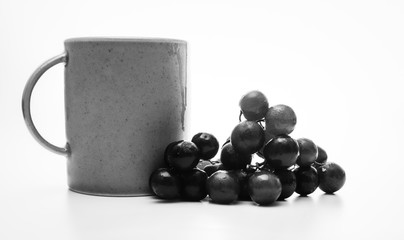 Coffee and grapes in black and white