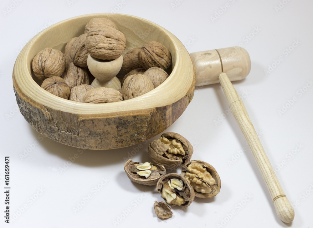 Wall mural walnuts. nuts of walnuts with nutcracker. isolated white backgro