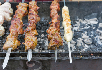 Shish kebab and shashlik on a grill outdoors