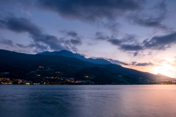 Sunset over mountain town located at lake