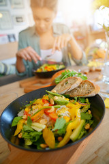 Closeup of veggie salad set on restaurant table