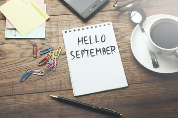 hello september text on paper