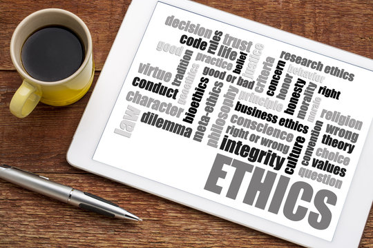 ethics word cloud on tablet with coffee